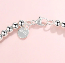Load image into Gallery viewer, Sterling Silver Round Bead Bracelet with Dangling Blue/Green, Red, Pink or Silver Heart